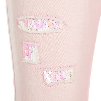Girls light pink ripped skinny sequin jeans
